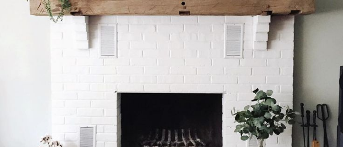 White Fireplace With Wood Mantel