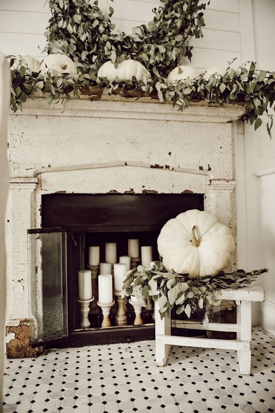 aging mantel with candles in the firebox